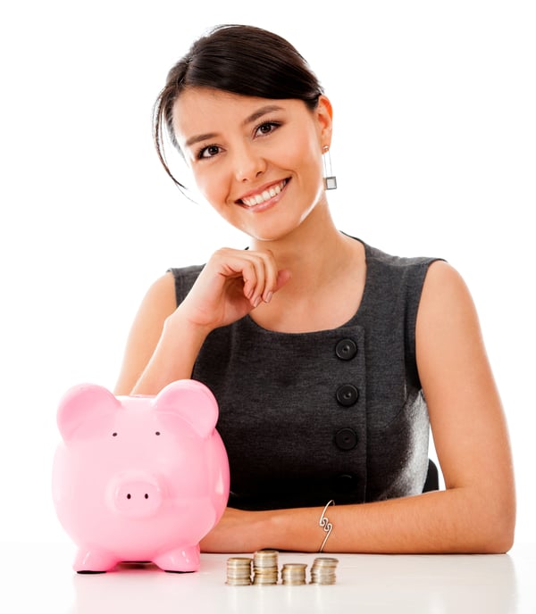 Business woman saving money in a piggybank - isolated over a white background
